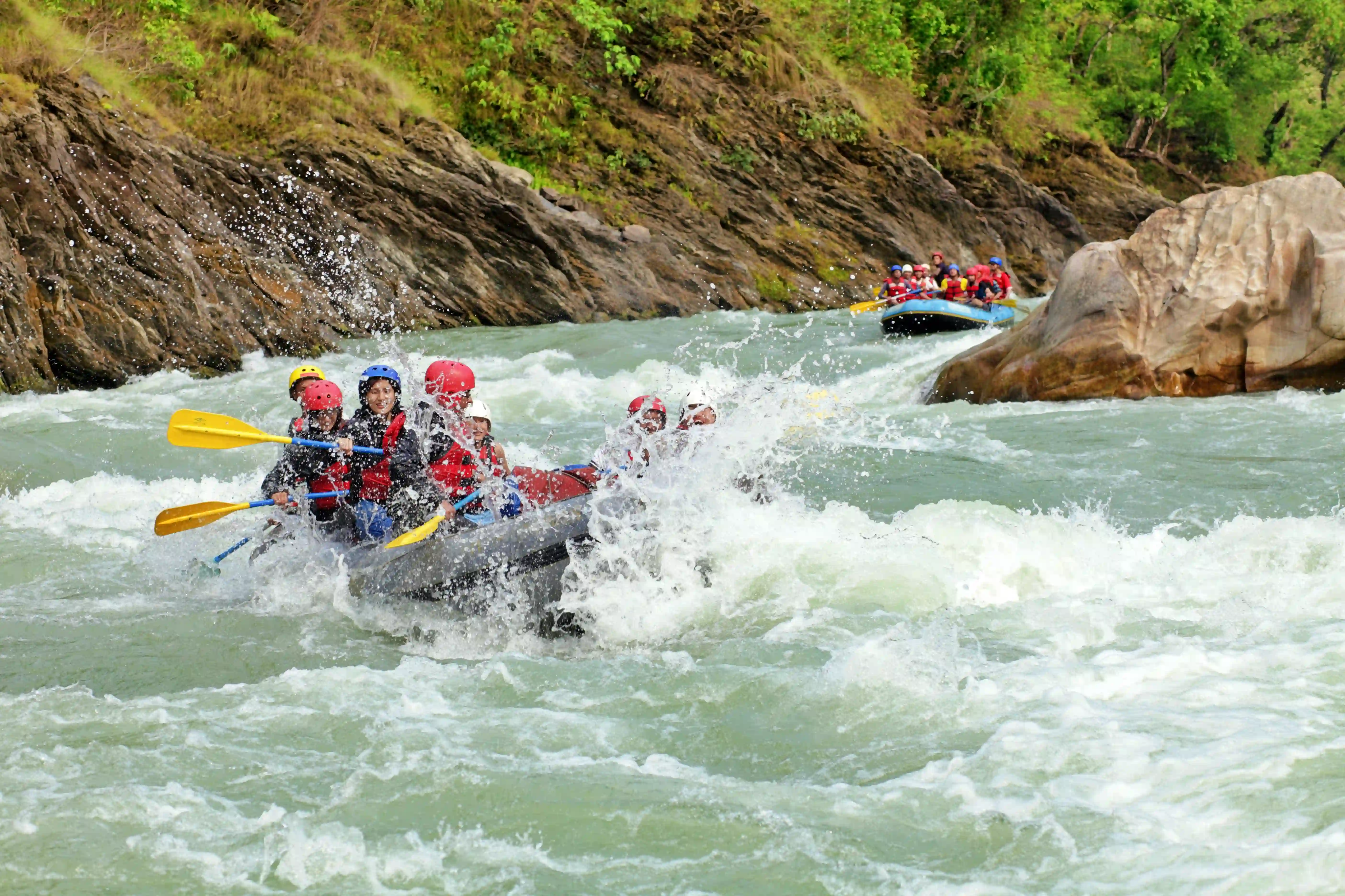 Group of people rafting on a river