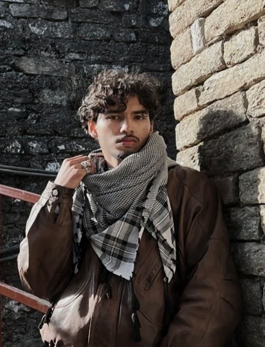 Team member chatting with guests in a common area